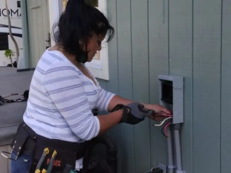 Licensed electrician wiring an exterior subpanel in Lower Moreland
