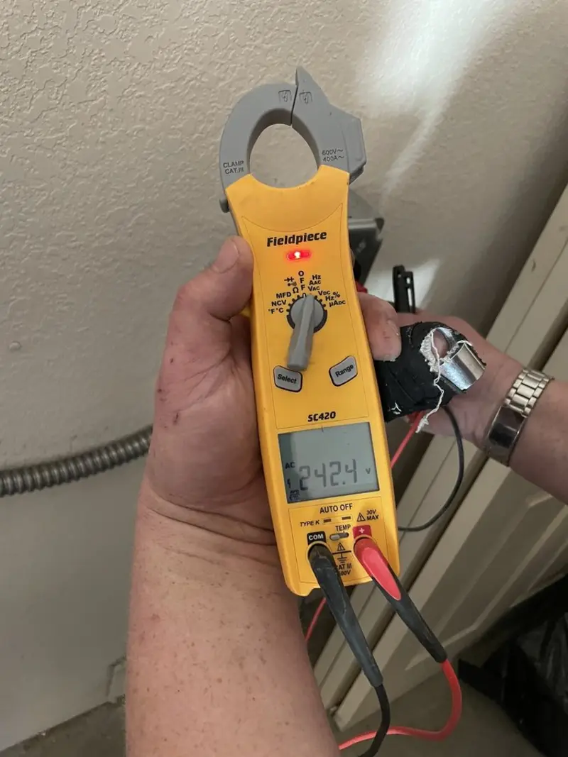 Voltage testing with clamp meter during Recessed Lighting Installation in Lower Moreland